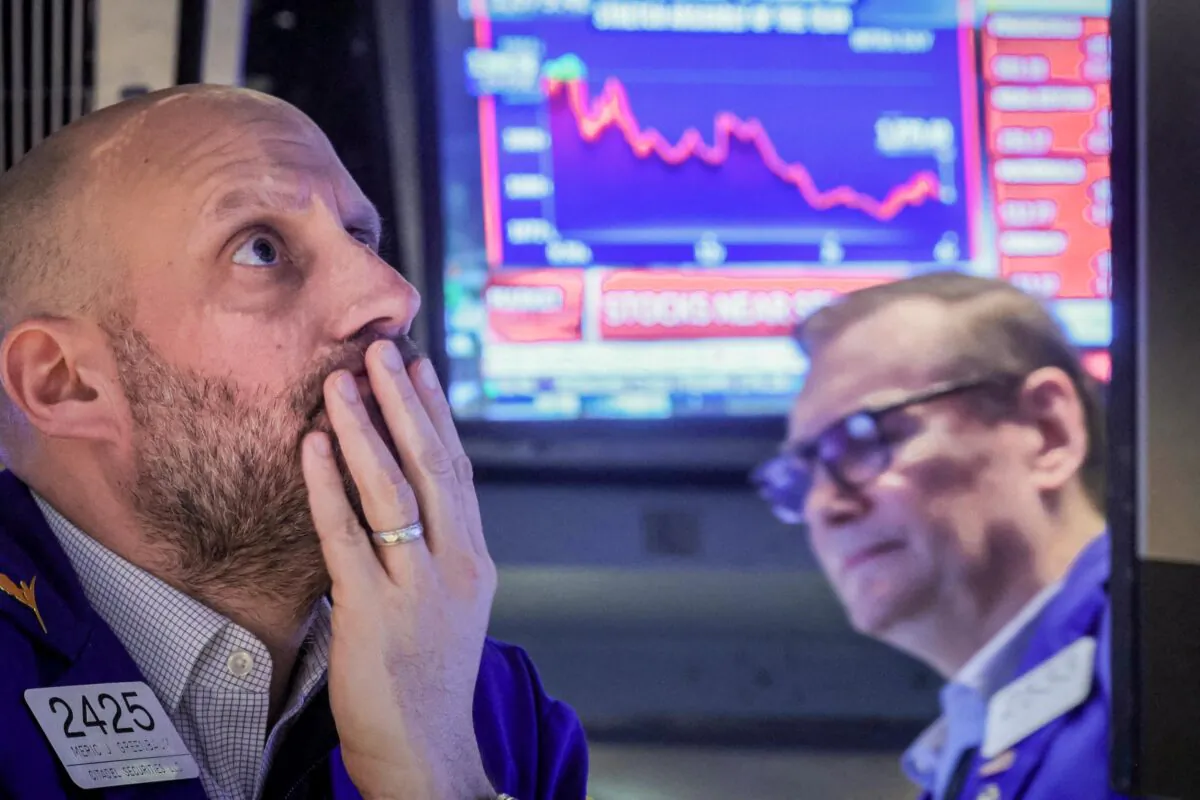 Traders work on the floor of the New York Stock Exchange (NYSE) in New York on March 7, 2023. (Brendan McDermid/Reuters)