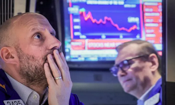 Traders work on the floor of the New York Stock Exchange (NYSE) in New York on March 7, 2023. (Brendan McDermid/Reuters)