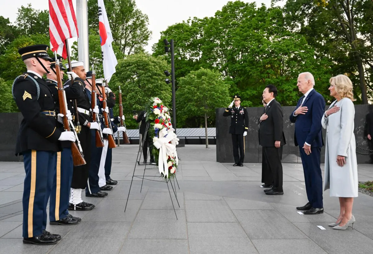US President Joe Biden, First Lady Jill Biden, South Korea President Yoon Suk Yeol and First Lady Kim Keon Hee pay their respects as they visit the Korean War Veterans Memorial in Washington, DC on April 25, 2023. (JIM WATSON/AFP via Getty Images)