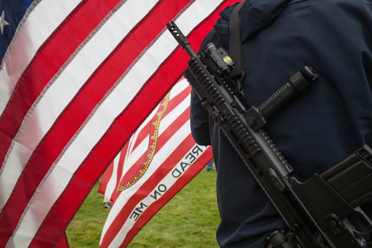 A demonstrator utilizes his right to openly carry a rifle during a pro-gun rally in Olympia, Wash.,  on Jan. 19, 2013. (David Ryder/Getty Images)