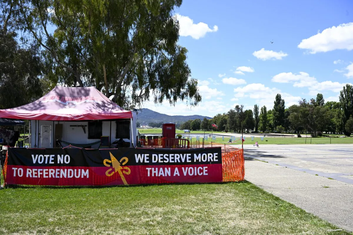Banners reasing ‘Vote No to Referendum’ and ‘We deserve more than a voice’ are seen at the Aboriginal tent Embassy in Canberra, Australia, on Feb. 15, 2023. (AAP Image/Lukas Coch)