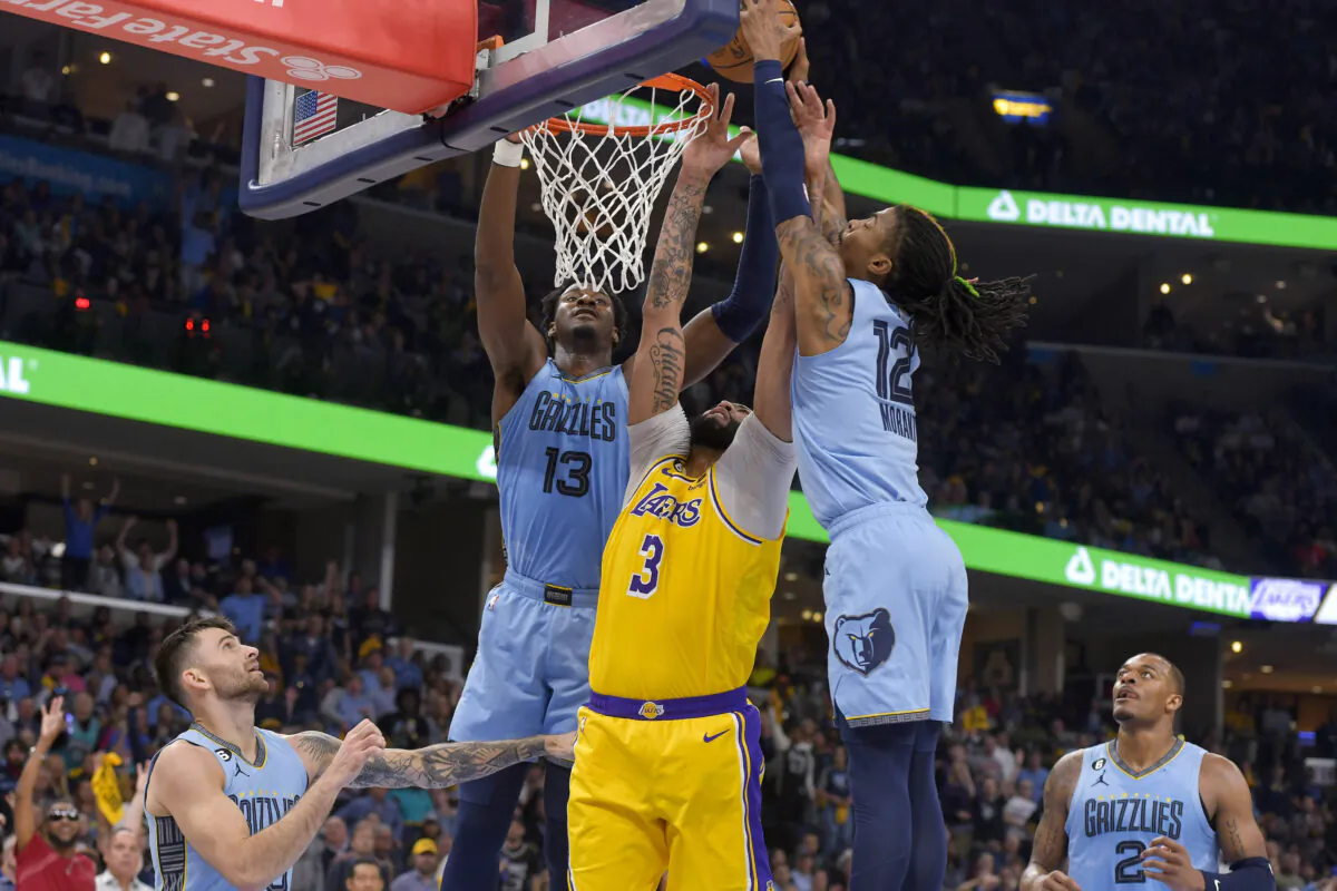 Memphis Grizzlies guard Ja Morant (12) shoots over Los Angeles Lakers forward Anthony Davis (3) during the first half of Game 5 in a first-round NBA basketball playoff series in Memphis, Tenn., on April 26, 2023. (Brandon Dill/AP Photo)