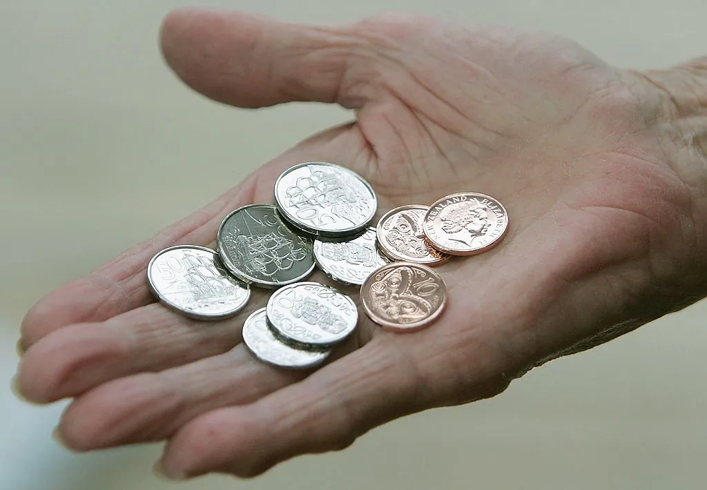 New Zealand's 10, 20, and 50 cent pieces sit in the palm of a hand in Auckland, New Zealand, on July 31, 2006. (Sandra Mu/Getty Images)