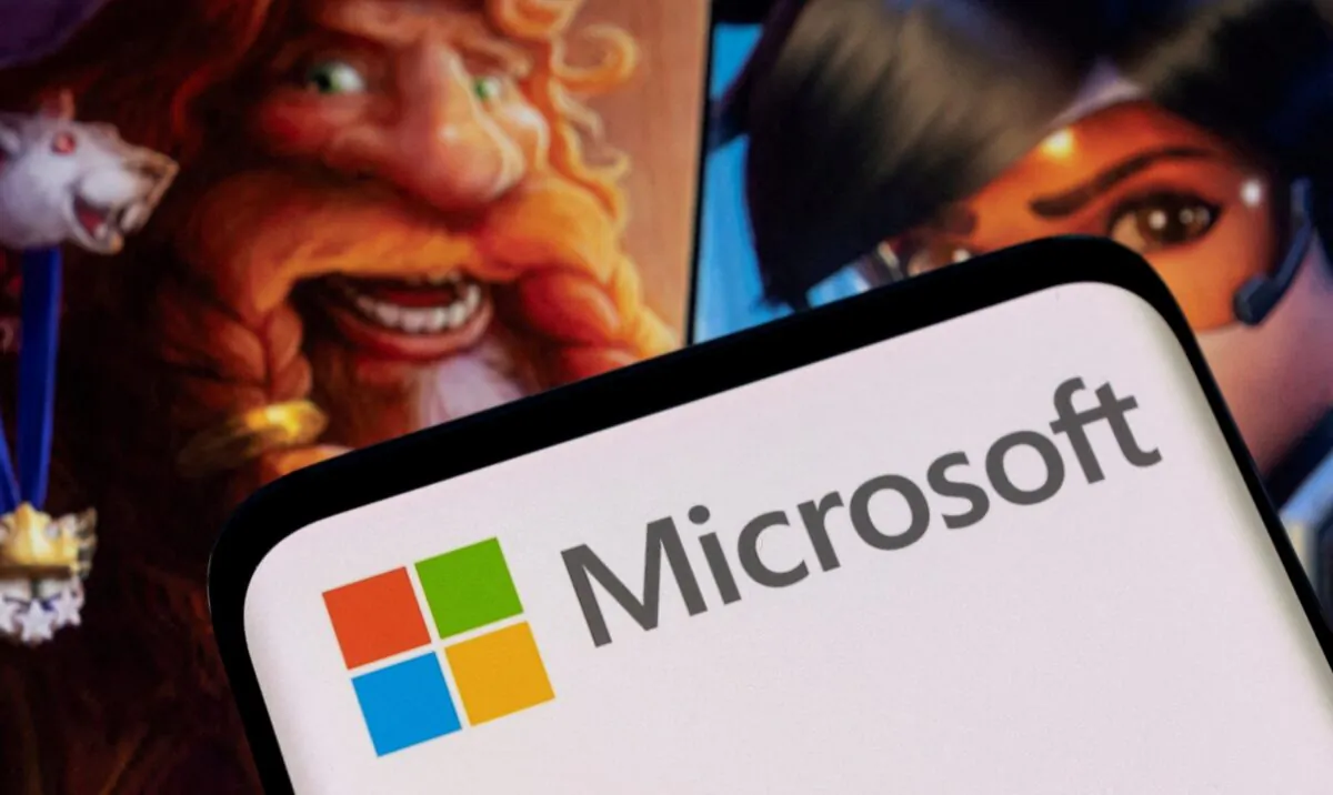 Microsoft logo on a smartphone placed on displayed Activision Blizzard's games characters on Jan. 18, 2022. (Dado Ruvic/Reuters)
