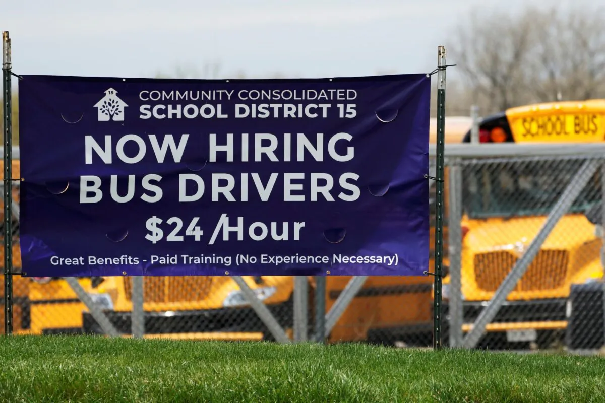 A hiring sign seeking bus drivers stands in Palatine, Ill., on April 19, 2023. (Nam Y. Huh/AP Photo)
