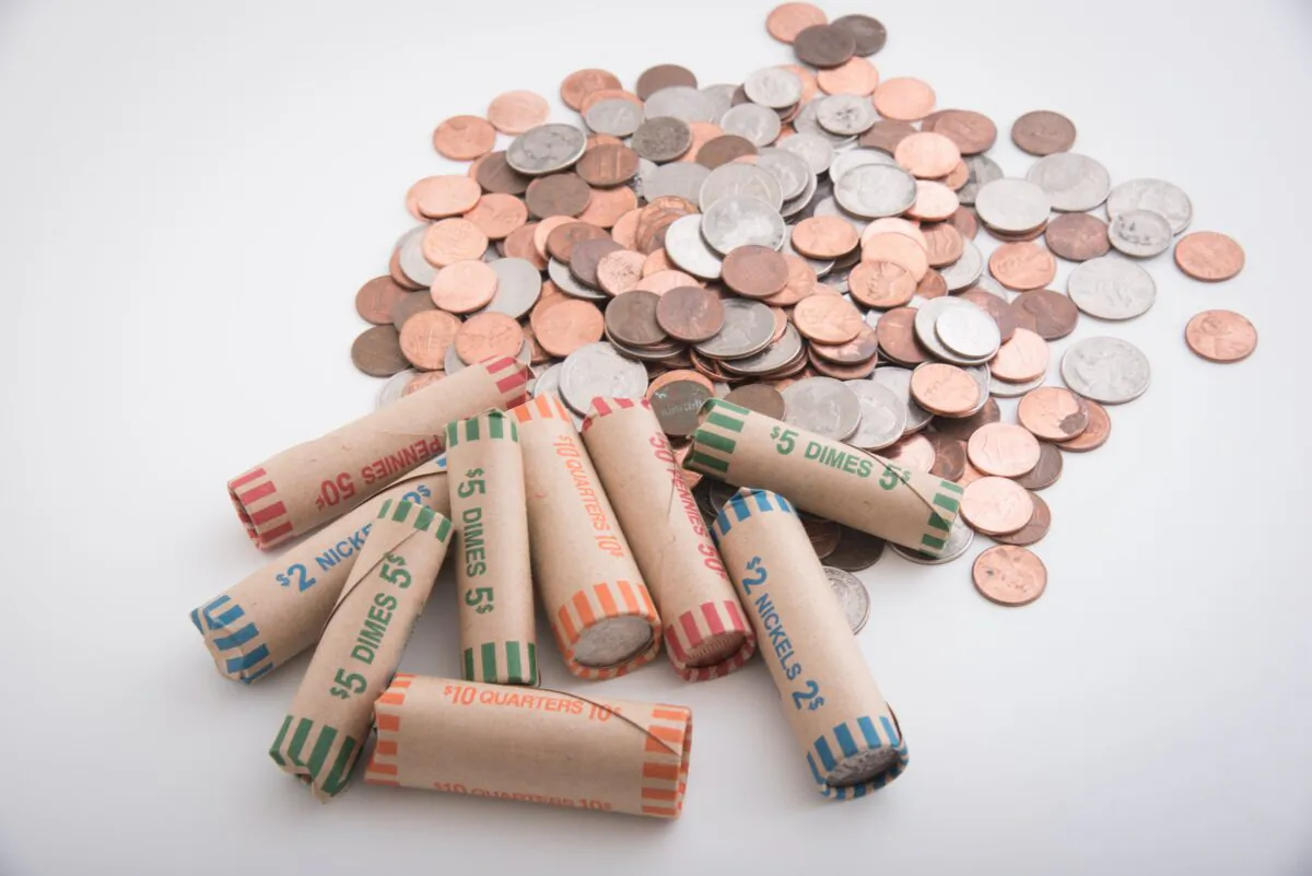 Coin counting machines are fast but take a cut, and rolling coins can be time consuming. (Atsushi Hirao/Shutterstock)