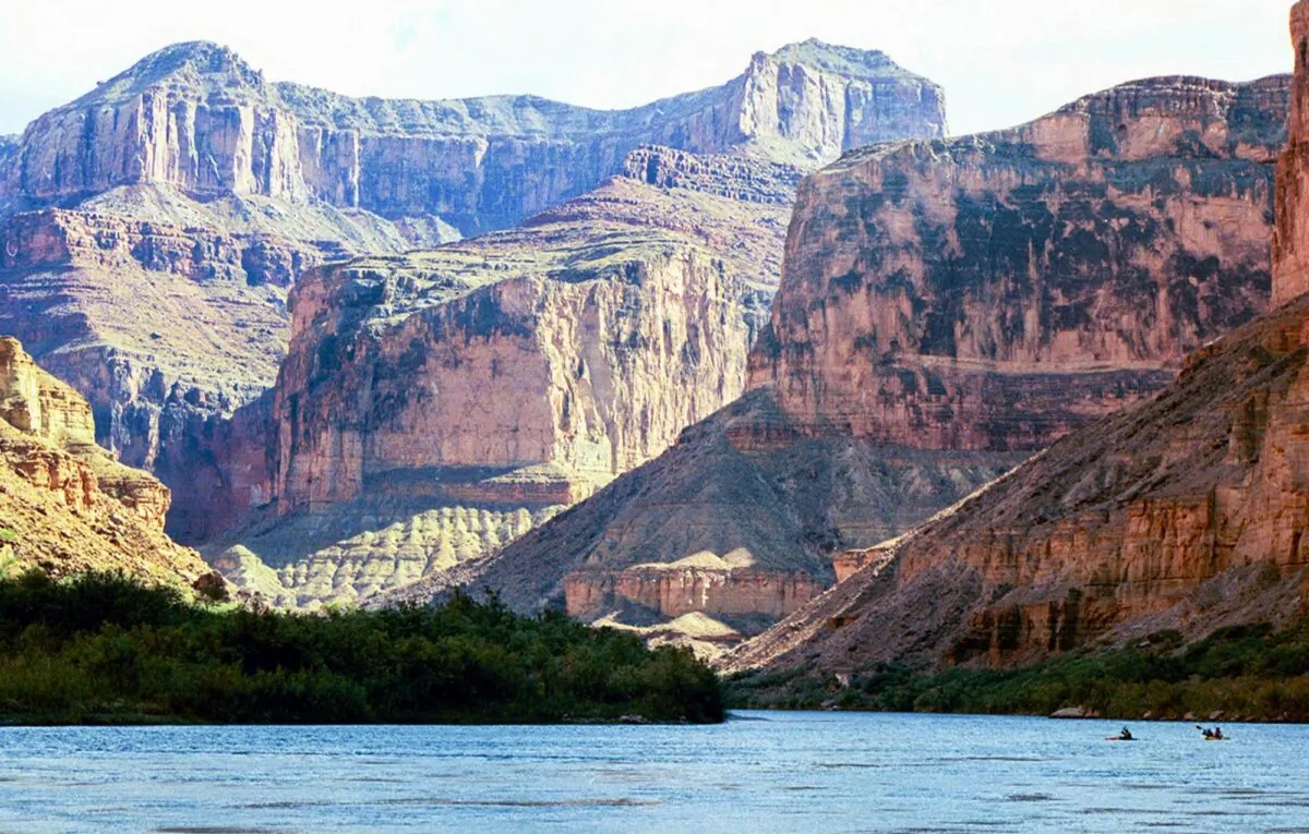 FILE - This Aug. 29, 2002 file photo, shows the Colorado River at the Grand Canyon National Park, in Arizona. A new report by a federal watchdog outlines a history of sexual harassment on river rafting trips run by Grand Canyon National Park. The report obtained by The Associated Press comes after 13 current and former park employees filed a complaint in 2014 saying women had been abused. It’s set to be released later Tuesday, Jan. 12, 2016, by the Department of the Interior’s Office of Inspector General. (AP Photo/Brian Witte, File)