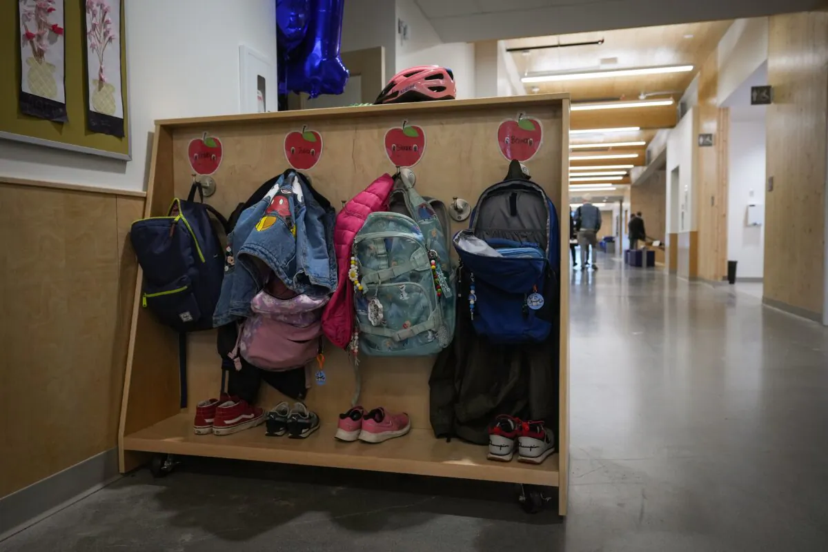 Backpacks, jackets, and shoes belonging to students at an elementary school classroom in Vancouver, British Columbia, on April 13, 2023. (Darryl Dyck/The Canadian Press)