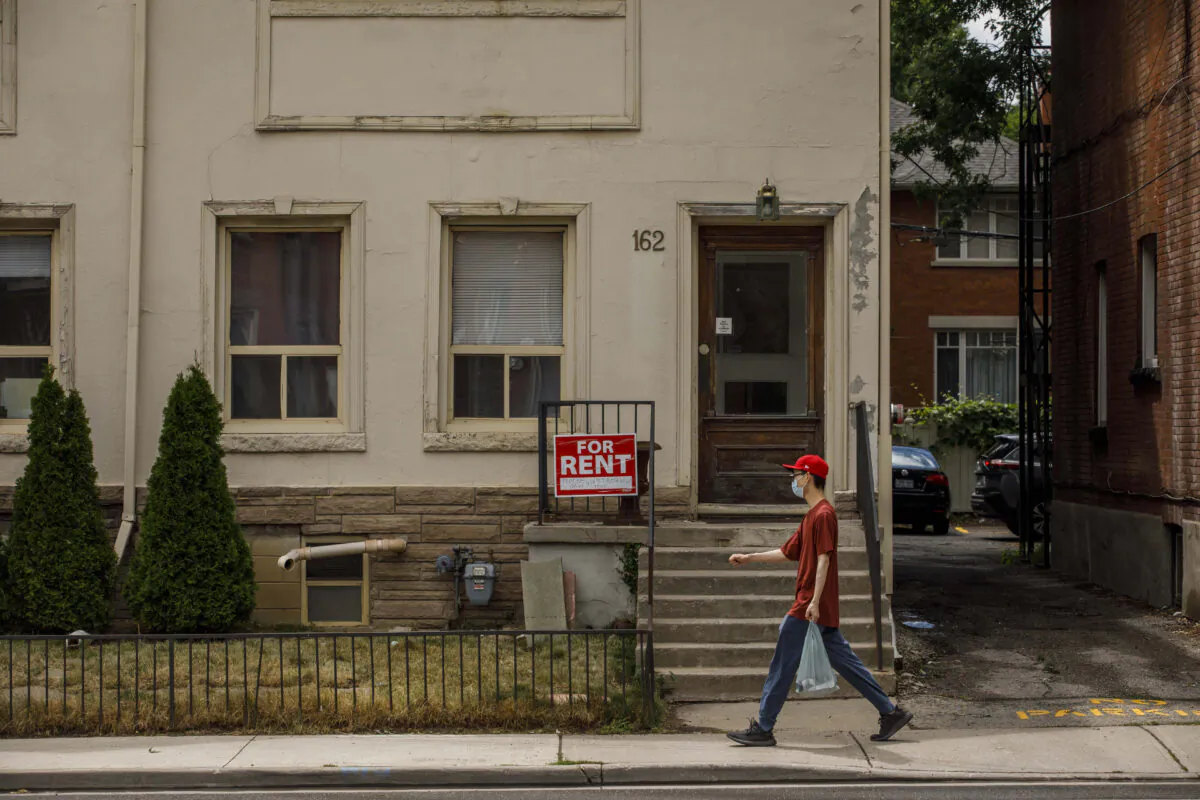 A for rent sign outside a home in Toronto on July 12, 2022. (Cole Burston/The Canadian Press)