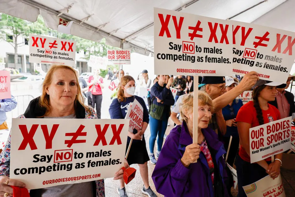 Demonstrators listen to the speaking program during an "Our Bodies, Our Sports" rally for the 50th anniversary of Title IX at Freedom Plaza in the District of Columbia on June 23, 2022. (Anna Moneymaker/Getty Images)