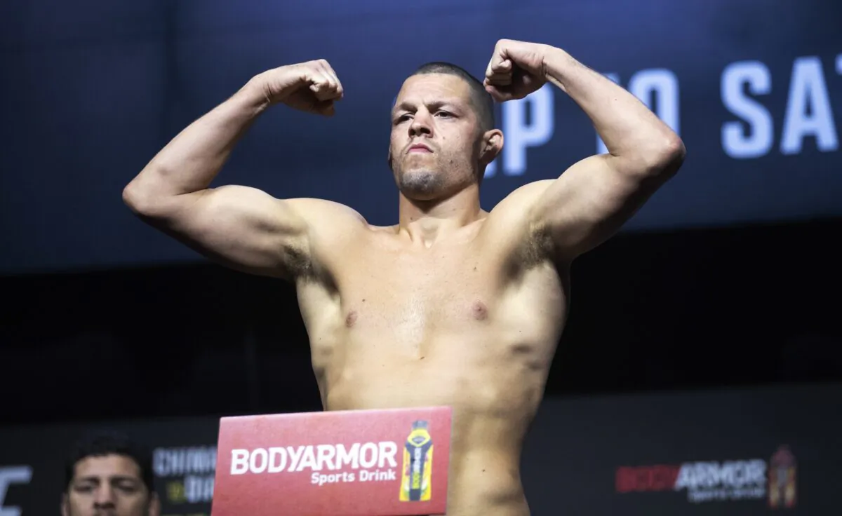 Welterweight fighter Nate Diaz poses on the scale during a ceremonial weigh-in for the UFC 279 mixed martial arts event in Las Vegas on Sept. 9, 2022. (Steve Marcus/Las Vegas Sun via AP)