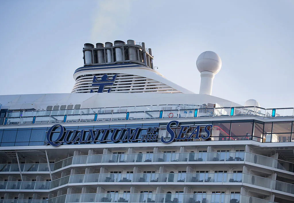 People sit and enjoy the facilites on the top deck onboard the cruise ship Quantum of the Seas in Southampton, England, on Oct. 31, 2014. (Matt Cardy/Getty Images)