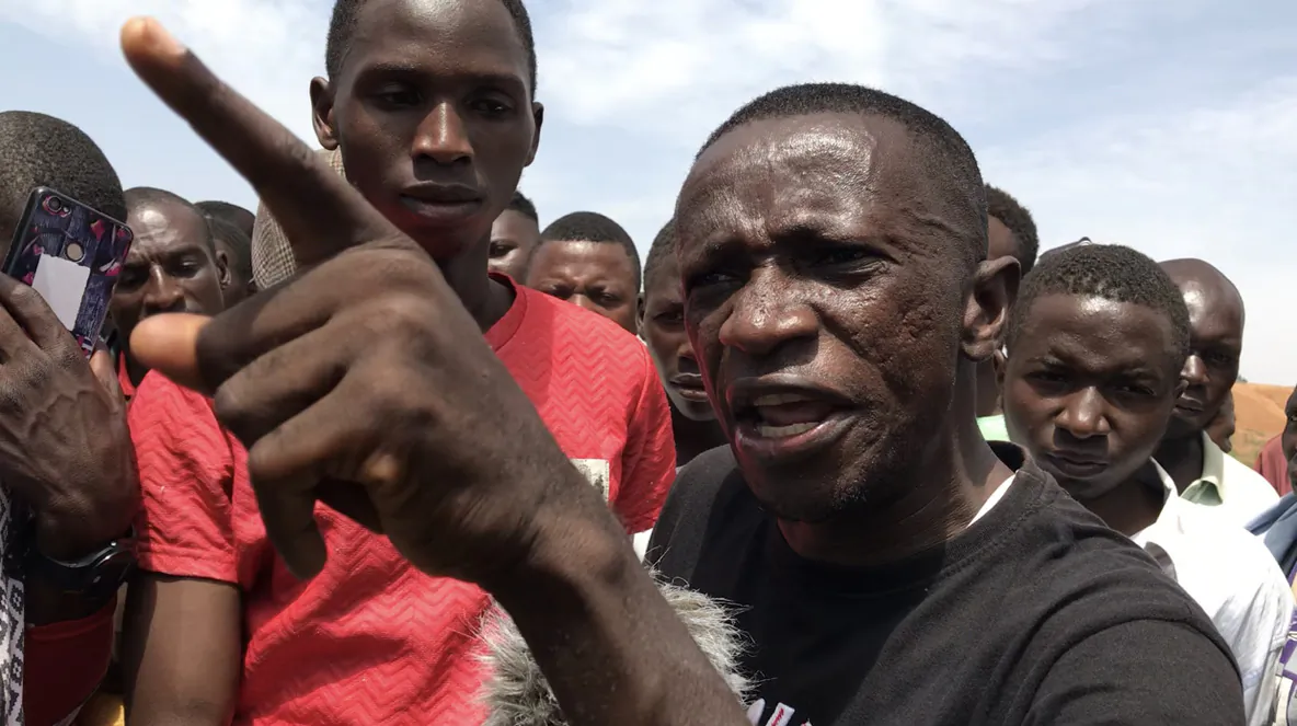 Human rights attorney Solomon Dalyop in Jos taunts soldiers: "Is the military here to protect us or to assist the terrorists who are attacking us?” (Photo by Masara Kim)
