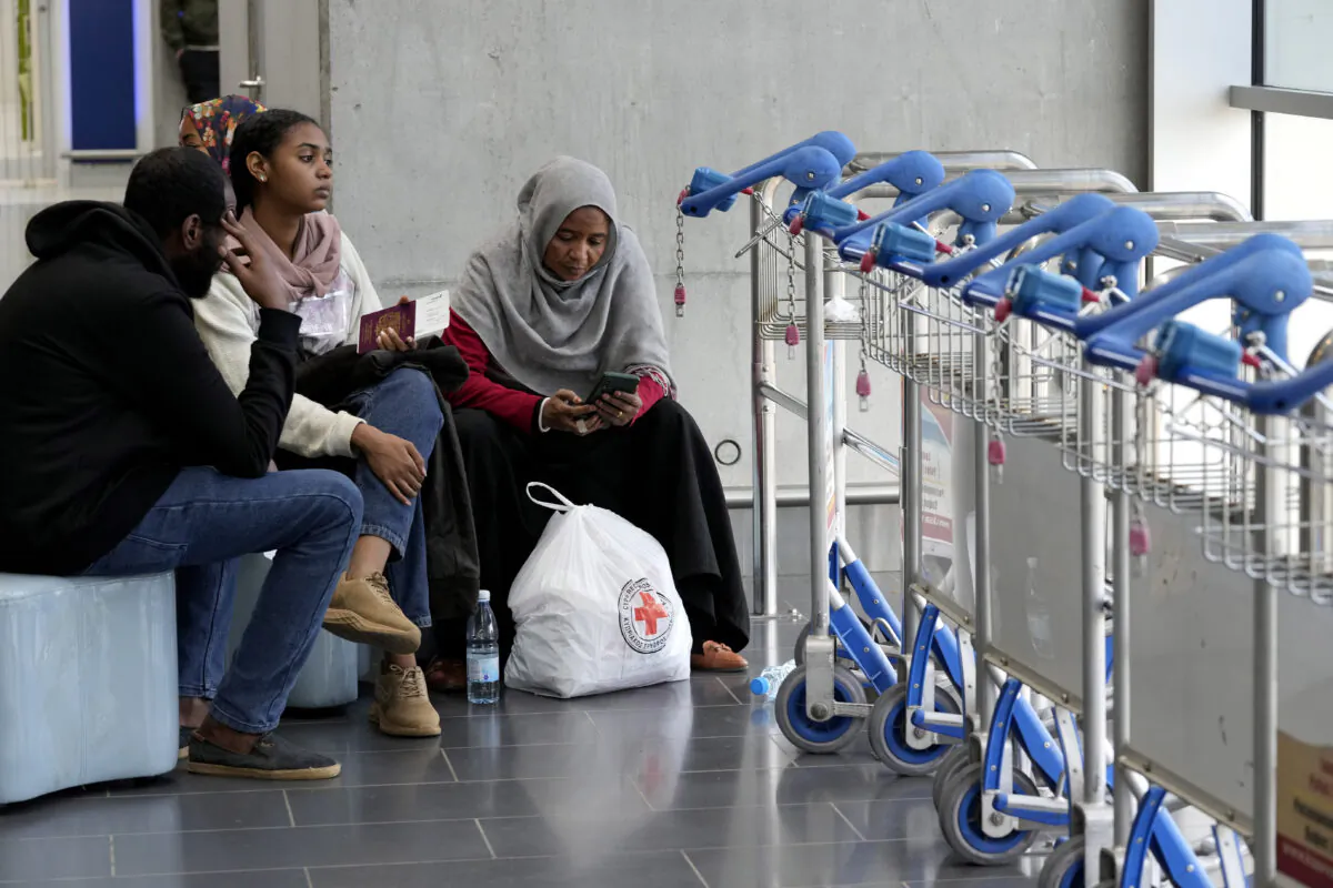 Evacuees from Sudan wait for their flight at Larnaca airport in Cyprus, on April 27, 2023. (Petros Karadjias/AP Photo)