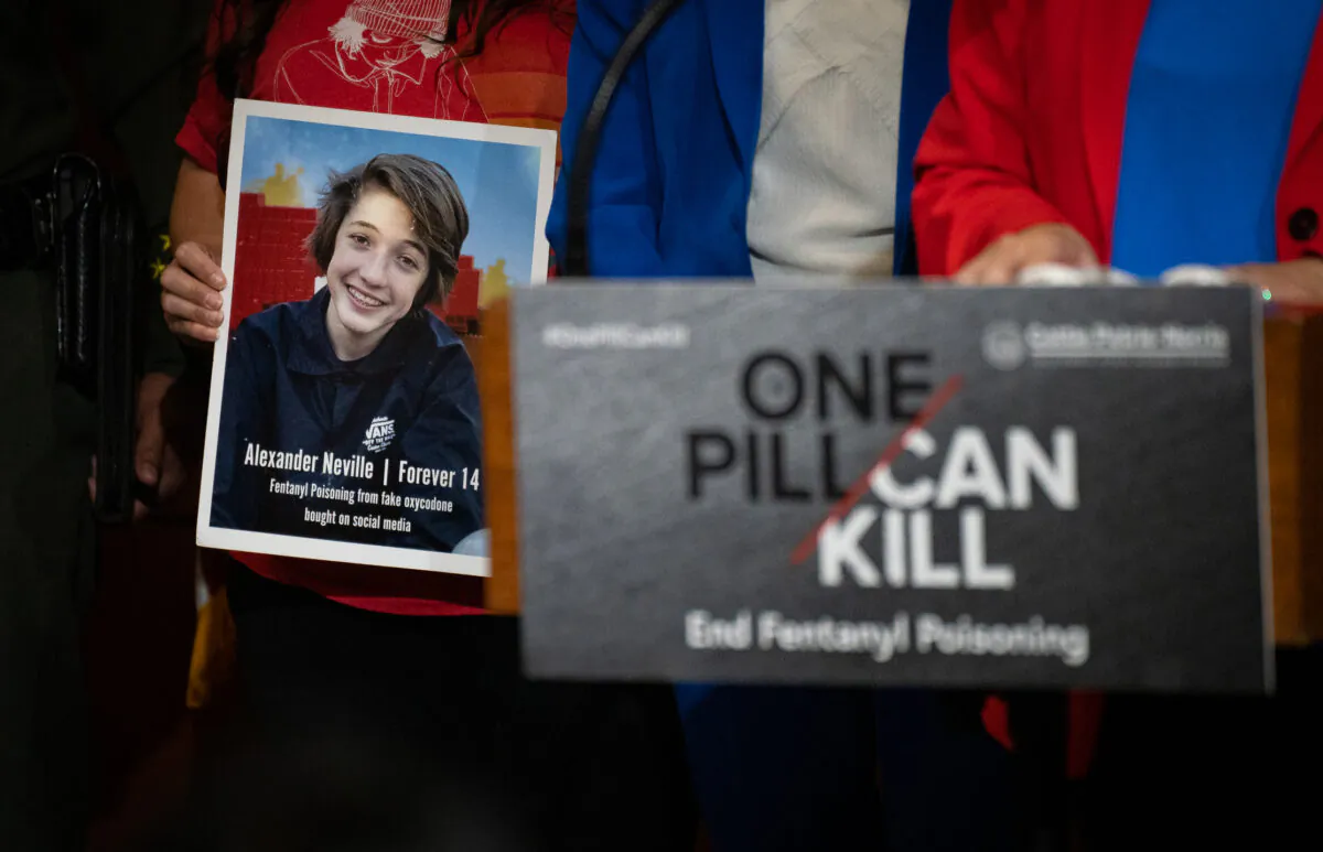 A photo of 14-year-old Alexander Neville who died after accidentally taking fentanyl is displayed at a news conference with Orange County officials in Irvine, Calif., on April 28, 2023. (John Fredricks/The Epoch Times)