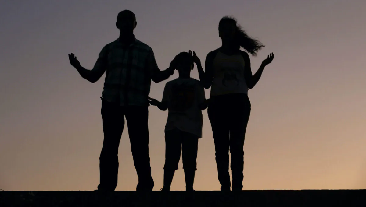 A Christian family prays in a file photo. (Patrick Baz/AFP via Getty Images)