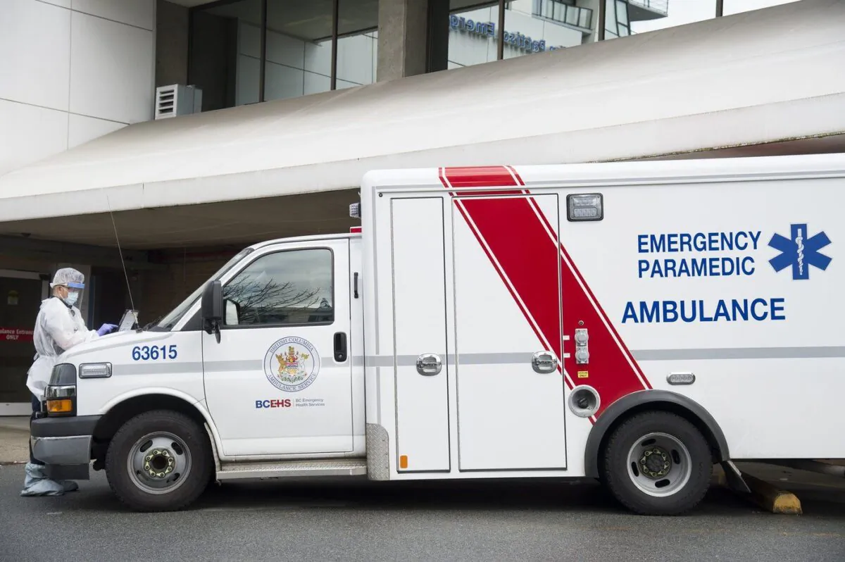 An ambulance is parked outside the Lions Gate Hospital in North Vancouver on March 23, 2020. (The Canadian Press/Jonathan Hayward)
