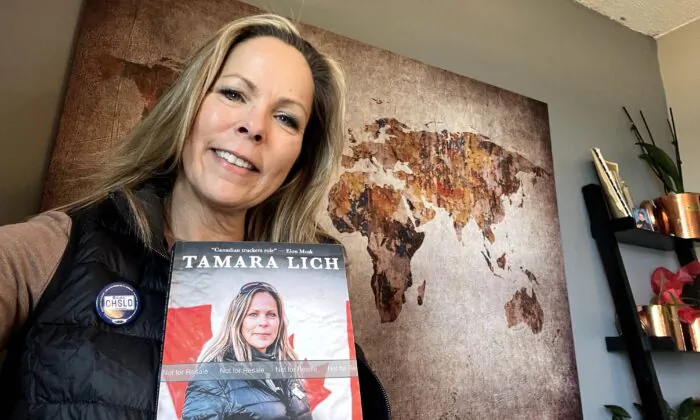 Tamara Lich, the grandmother from Alberta who became the face of the Freedom Convoy protest in Ottawa last winter, holds her new book, “Hold The Line: My story from the heart of the Freedom Convoy,” on April 26, 2023. (Courtesy of Tamara Lich)