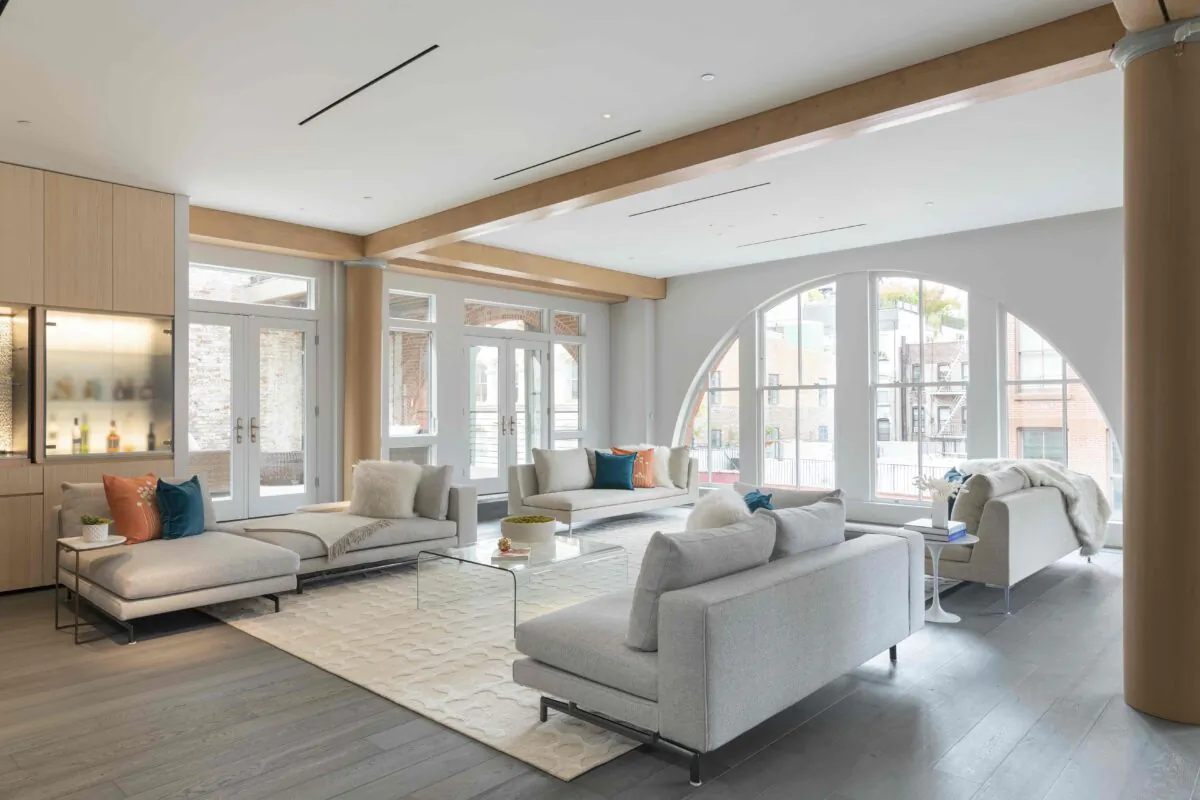 An expansive living room is kept open and airy through the use of neutral sofas and seating. (TNS)