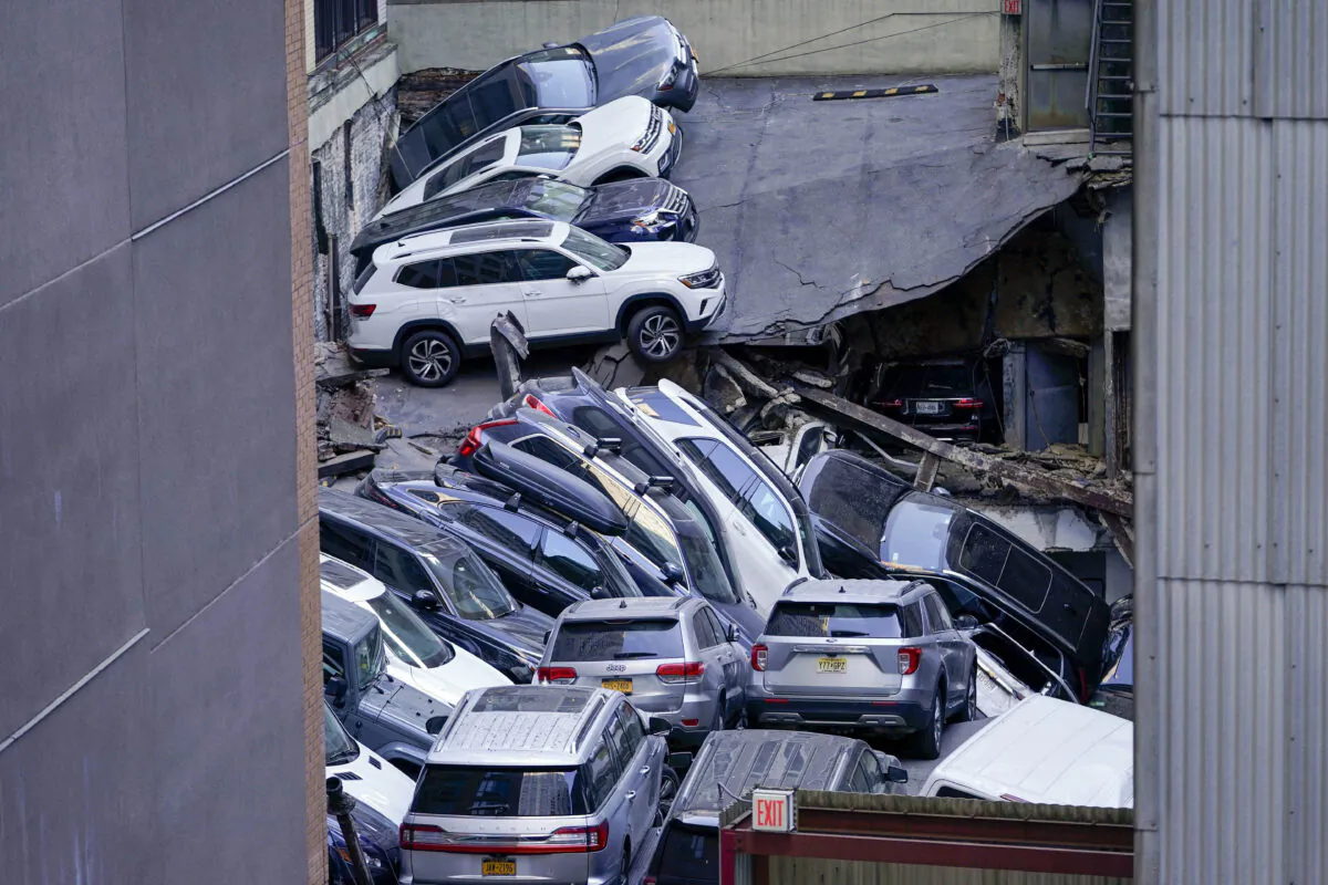 Cars are seen piled on top of each other at the scene of a partial collapse of a parking garage in the Financial District of New York on April 18, 2023. (Mary Altaffer/AP Photo, File)