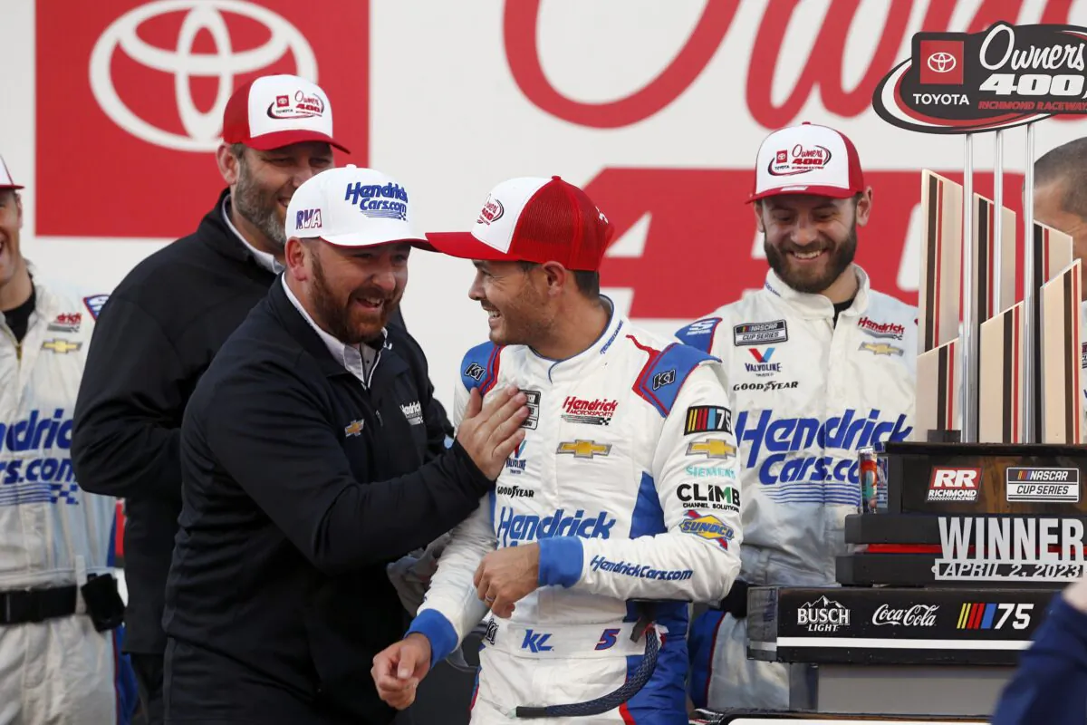 Kyle Larson (C) celebrates after winning a NASCAR Cup Series auto race at Richmond Raceway in Richmond, Va., on April 2, 2023. (Eva Russo/Richmond Times-Dispatch via AP)