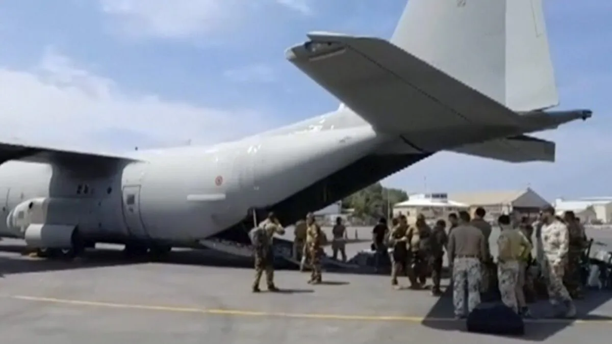 In this image from video provided by the Italian Defense Ministry, military personnel prepare to evacuate people from the airport in Khartoum, Sudan, on April 23, 2023. (The Canadian Press/Italian Defense Ministry via AP)
