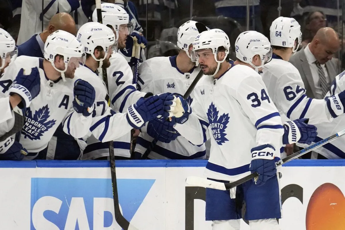 Toronto Maple Leafs center Auston Matthews (34) celebrates with the bench after his goal against the Tampa Bay Lightning during the second period in Game 6 of an NHL hockey Stanley Cup first-round playoff series April 29, 2023, in Tampa, Fla. (AP Photo/Chris O'Meara)
