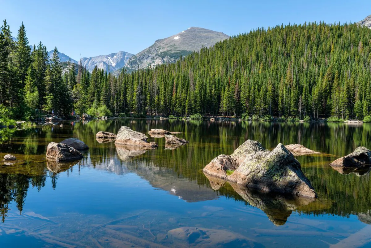 A sunny summer morning view of a rocky section of Bear Lake, Rocky Mountain National Park, Colorado, USA. (Sean Xu/Shutterstock)