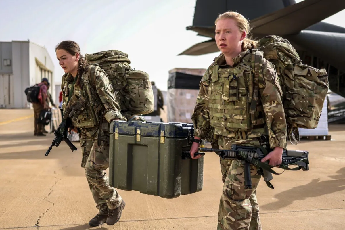 Medics from the Duke of Lancaster's Regiment of the British Army carry medical equipment as they arrive at Wadi Seidna airport in Khartoum, Sudan, on April 27, 2023. (UK Ministry of Defence via Getty Images)