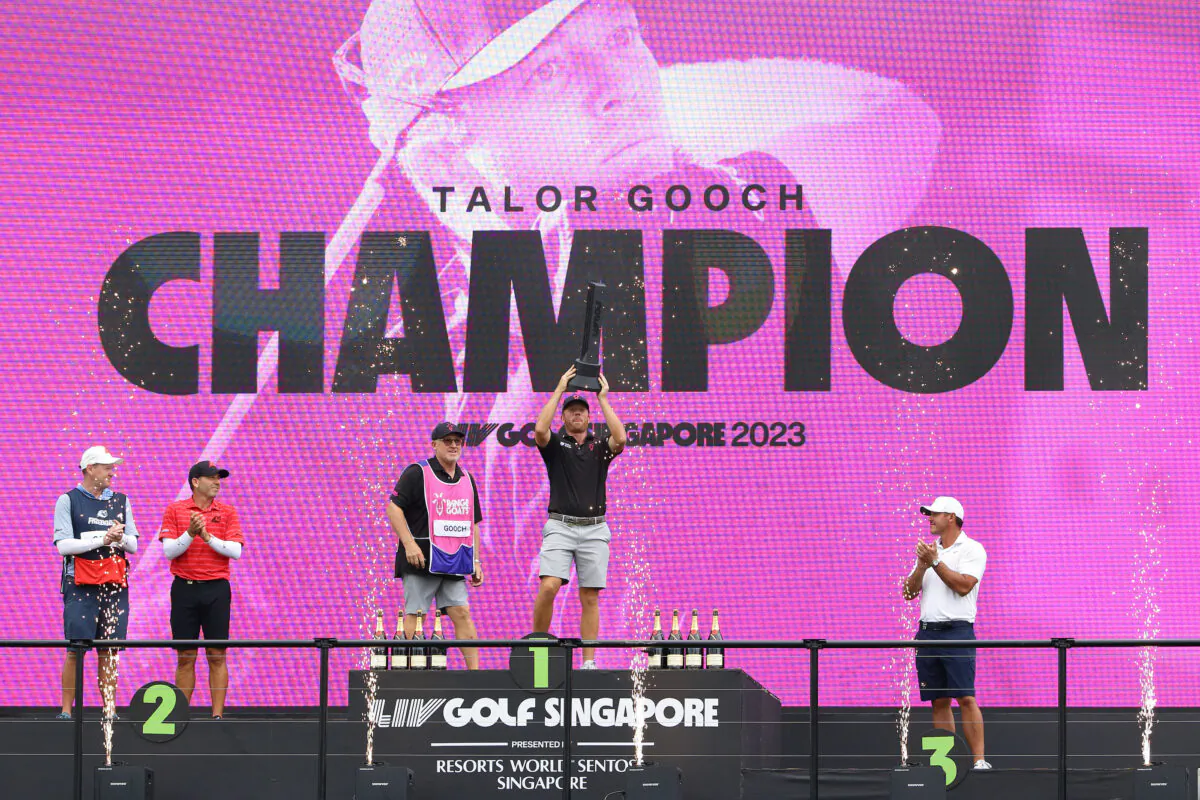 Sergio Garcia of Fireballs GC (2nd L),  Talor Gooch of RangeGoats GC (2nd R) and Brooks Koepka of Smash GC (R) celebrate on the podium during the prize presentation of the LIV Golf Invitational–Singapore at Sentosa Golf Club in Singapore on April 30, 2023. (Suhaimi Abdullah/Getty Images)