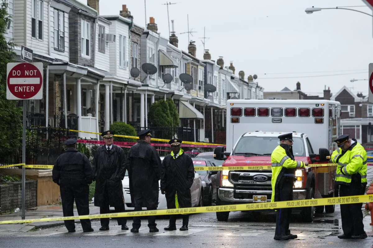 Law enforcement gather at the scene of a fatal shooting in Philadelphia on April 28, 2023. (Matt Rourke/AP Photo)