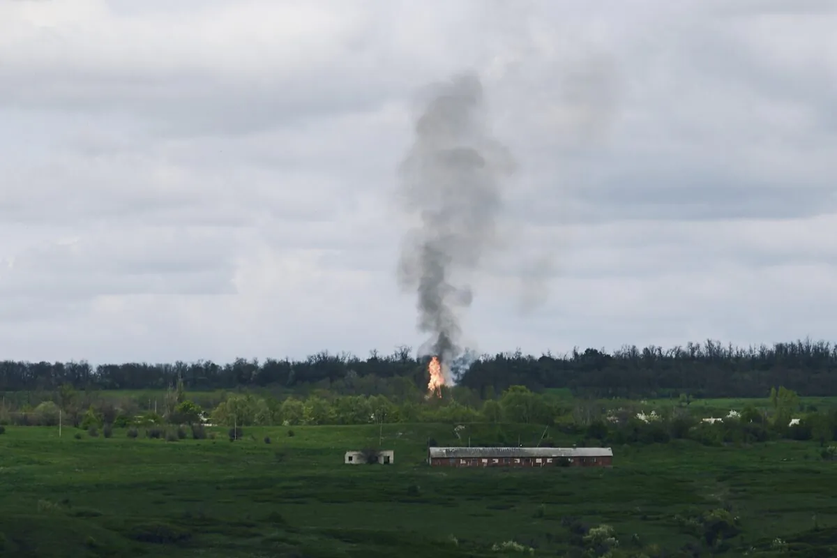 Fire and smoke raise after artillery shelling near Bakhmut, an eastern city where fierce battles between Ukrainian and Russian forces have been taking place, in the Donetsk region, Ukraine, on April 29, 2023. (Libkos/AP Photo)