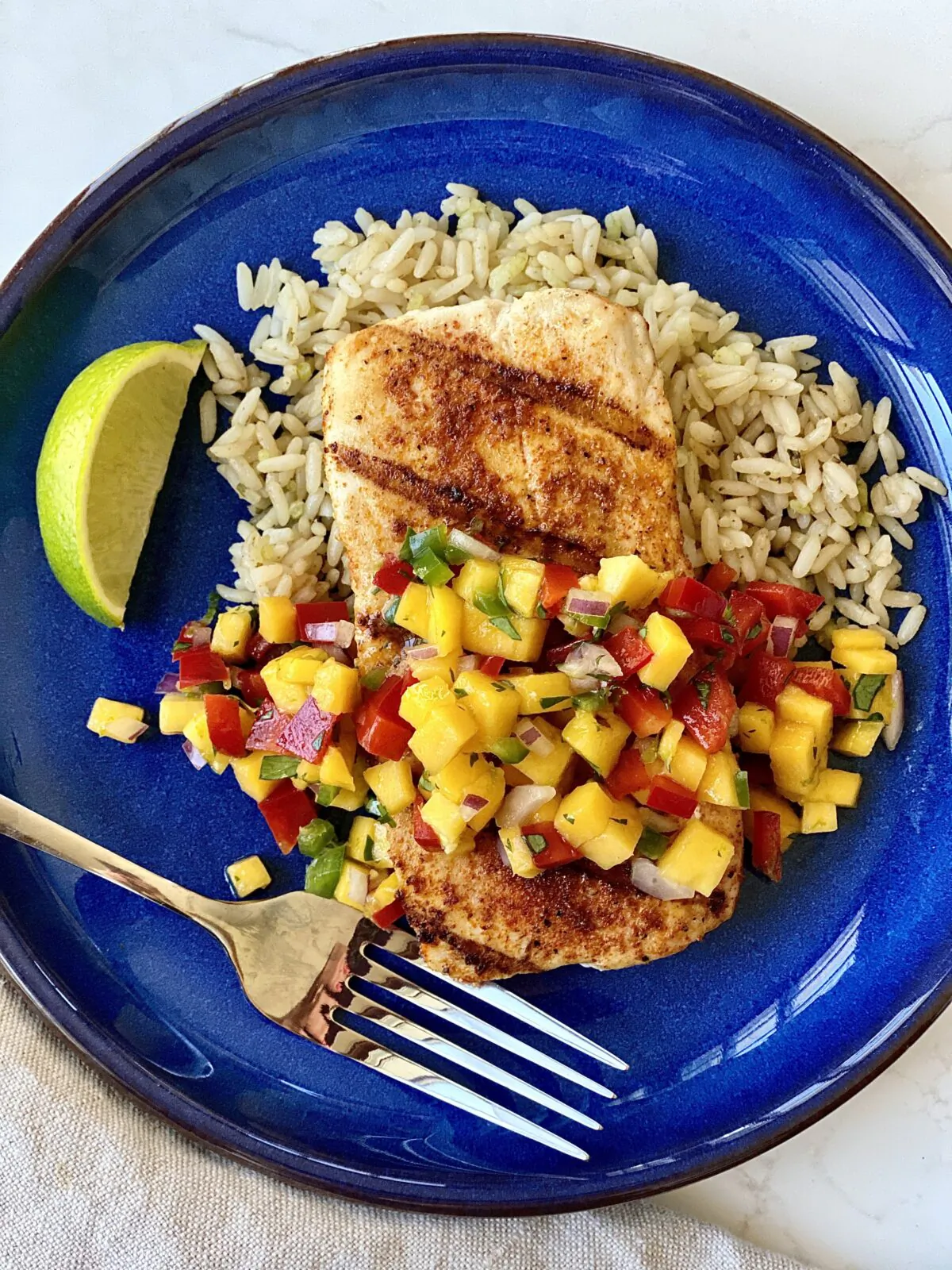 Grilled mahi-mahi with mango salsa. (Kelli Foster/TNS)
