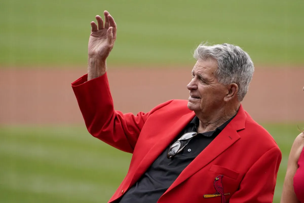 Mike Shannon waves as he is honored before the start of a baseball game between the St. Louis Cardinals and the Chicago Cubs in St. Louis on Oct. 3, 2021. (Jeff Roberson/AP Photo)