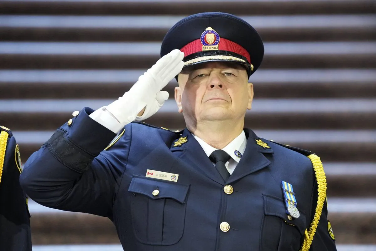 Then-incoming Toronto Police Chief Myron Demkiw salutes during the playing of the national anthem at a change of command ceremony in Toronto, on Dec.19, 2022. (The Canadian Press/Frank Gunn)
