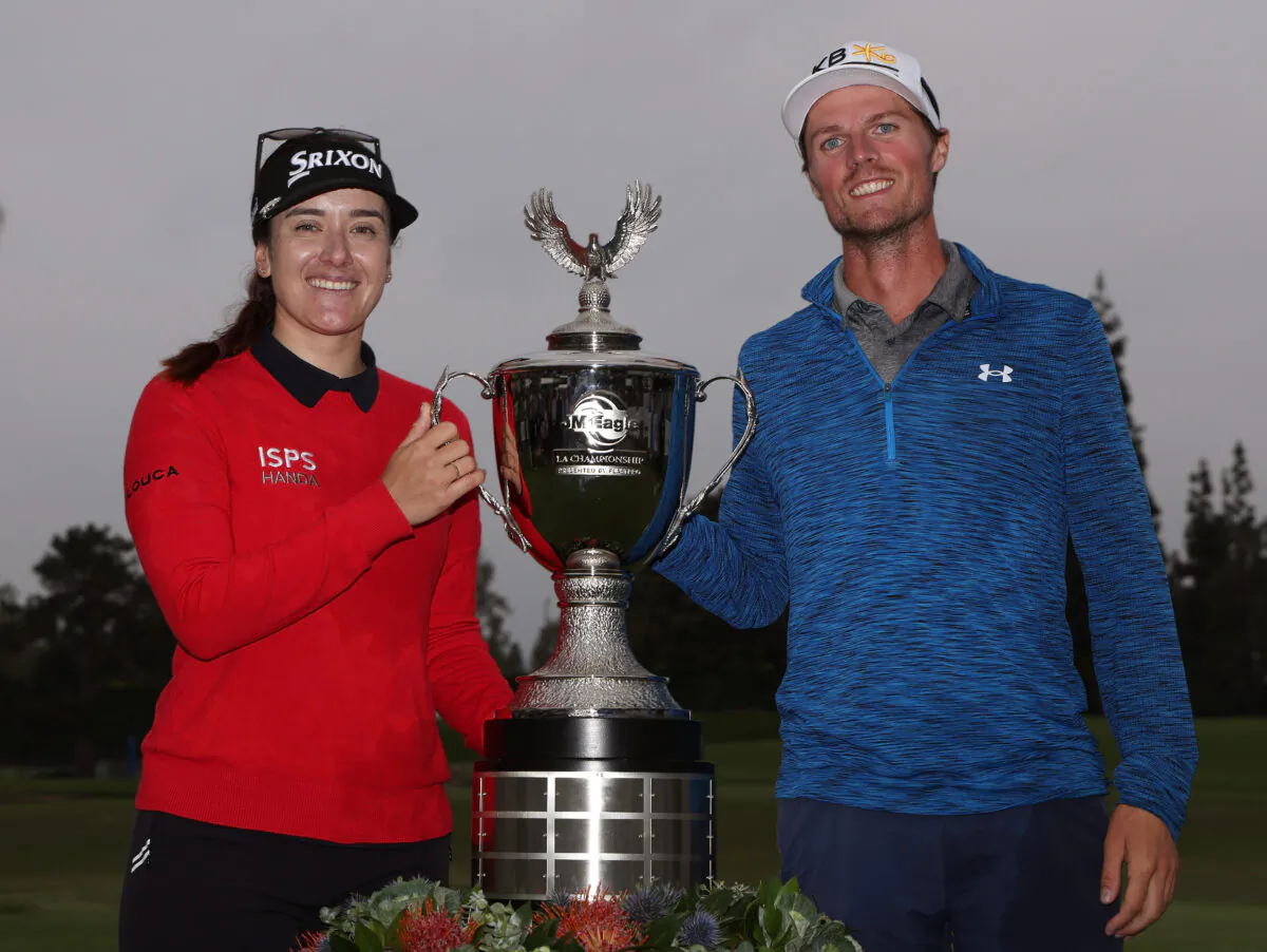 Hannah Green of Australia poses with the trophy and caddie Nate Blasko after victory during the final round of the JM Eagle LA Championship presented by Plastpro at Wilshire Country Club in Los Angeles on April 30, 2023. (Harry How/Getty Images)