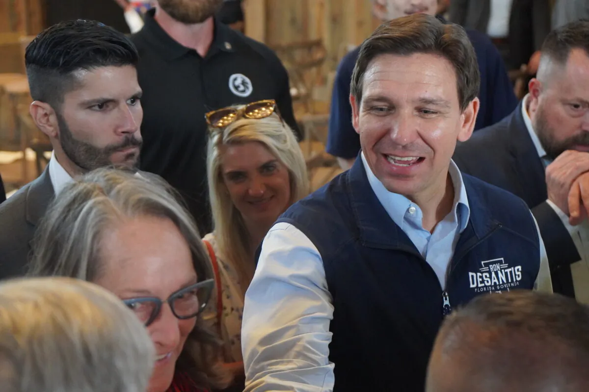 Florida Gov. Ron DeSantis works the crowd after delivering a 2024 Republican presidential primary speech before about 200 people in Pella, Iowa, about 45 miles east of Des Moines, on May 31, 2023. (John Haughey/The Epoch Times)