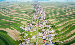 This Bizarre Town With Thin, Wavy Farms Looks Like Wonderland, Has One Road for 6,000 Villagers