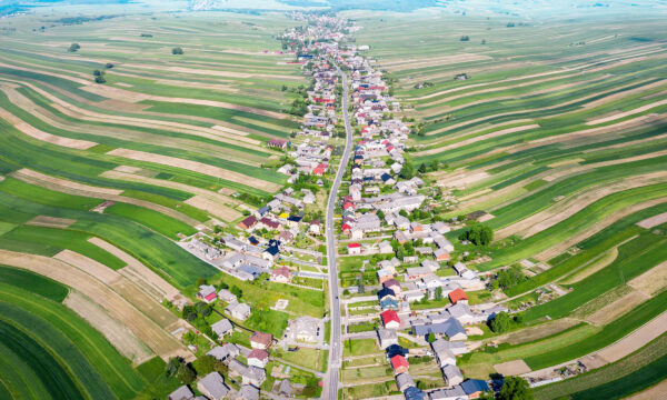 This Bizarre Town With Thin, Wavy Farms Looks Like Wonderland, Has One Road for 6,000 Villagers