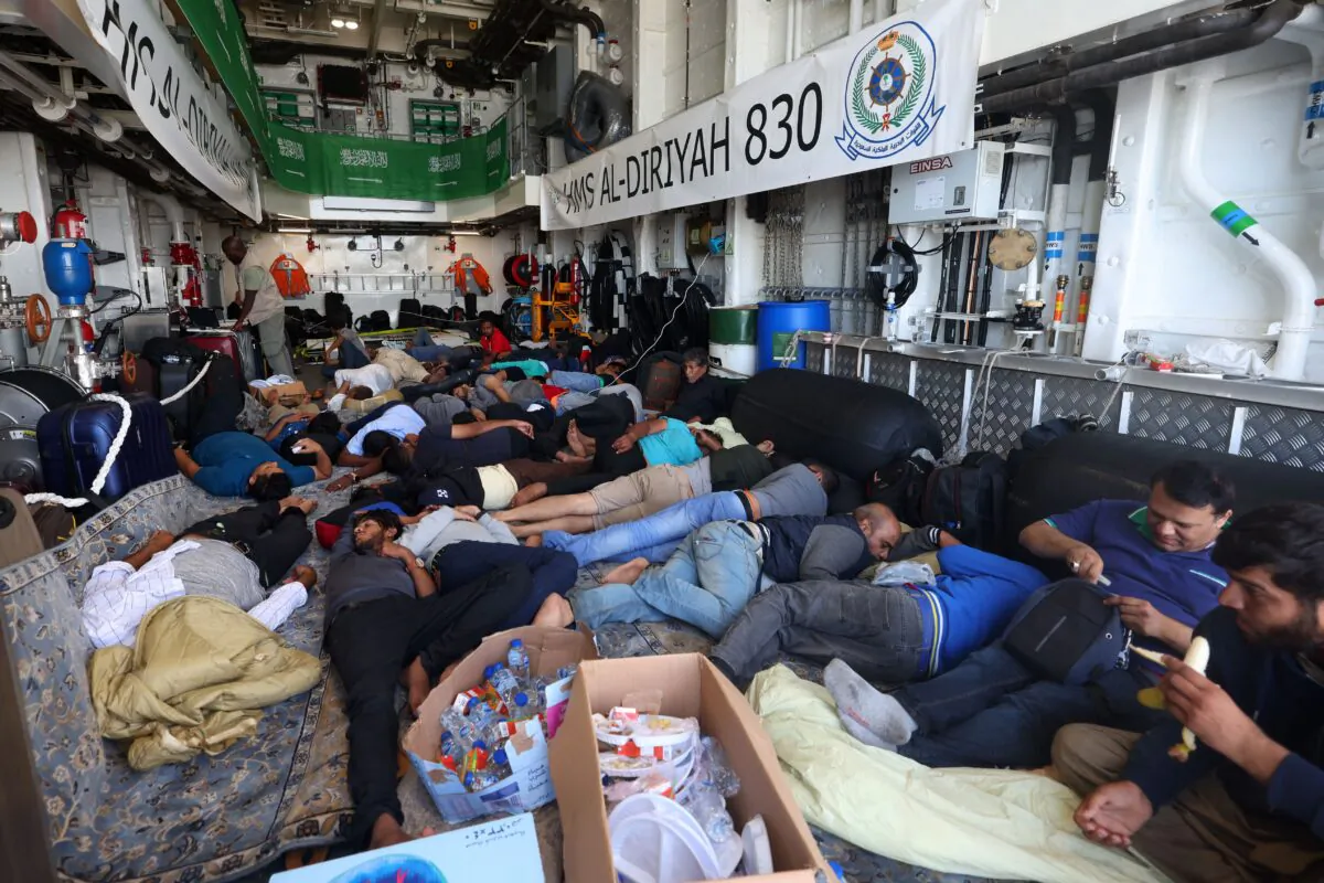 Evacuees rest onboard a Saudi vessel as it travels from Port of Sudan to Jeddah on April 30, 2023. (Fayez Nureldine/AFP via Getty Images)