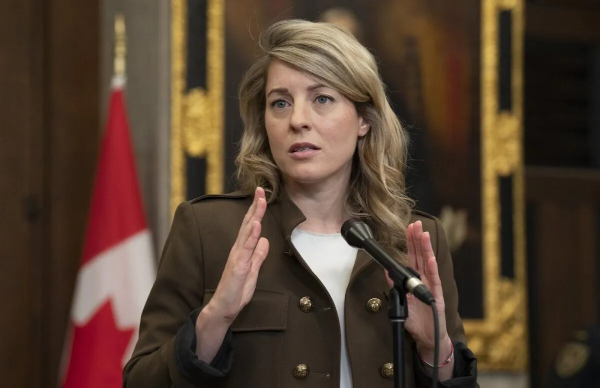 Foreign Affairs Minister Melanie Joly speaks with reporters in the foyer of the House of Commons in Ottawa on April 27, 2023. (The Canadian Press/Adrian Wyld)