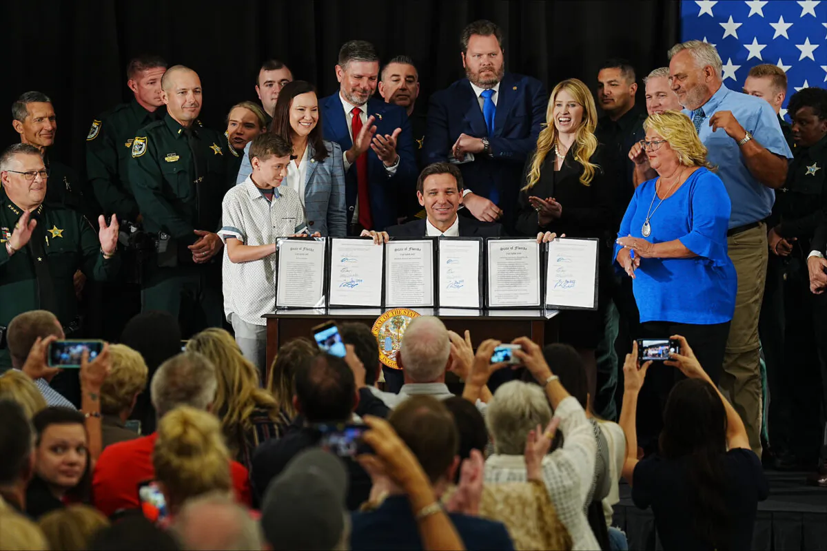 Florida Gov. Ron DeSantis signs an anti-crime bill on May 1, 2023 at the American Police Hall of Fame & Museum in Titusville, Fla.. (Courtesy of the Florida Governor's Office.)