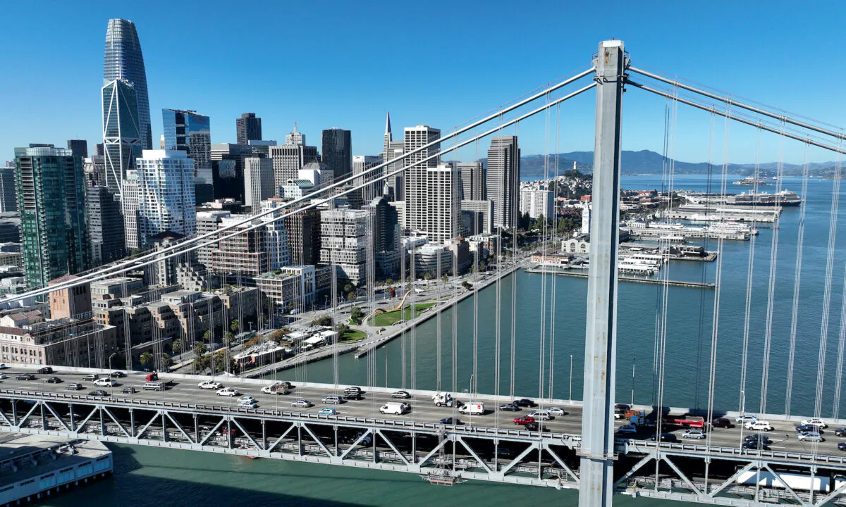 Cars drive by the San Francisco skyline as they cross the San Francisco-Oakland Bay Bridge on Oct. 27, 2022. (Justin Sullivan/Getty Images)