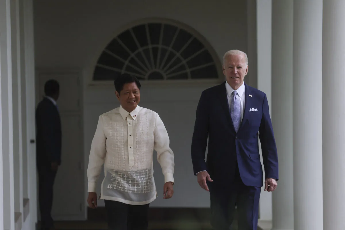Philippine President Ferdinand Marcos Jr. and U.S. President Joe Biden walk up the West Wing colonnade on their way to the Oval Office on May 1, 2023. (Leah Millis/Pool/AFP via Getty Images)