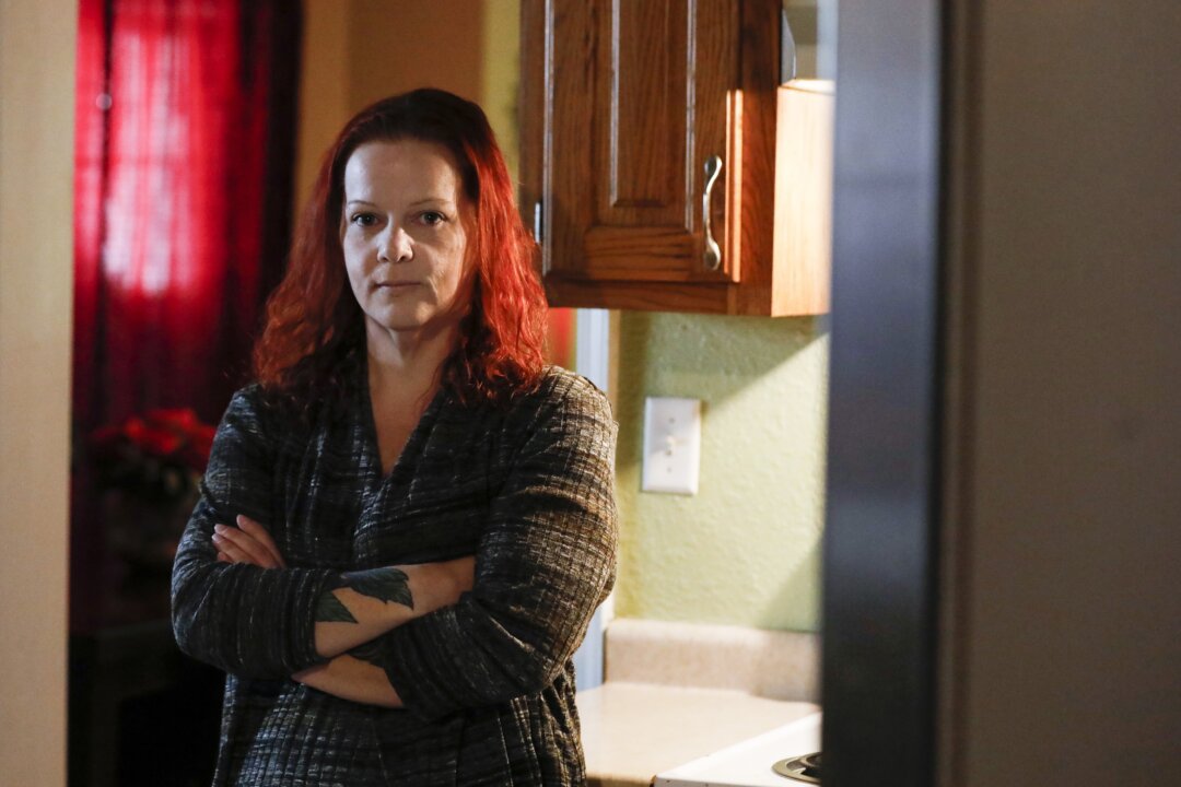 Mylissa Farmer stands for a portrait at her home in Joplin, Mo., on Sept. 28, 2022. (Nathan Papes/The Springfield News-Leader via AP)