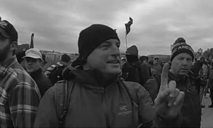 In this image from video footage, former FBI supervisor Jared Wise stands on U.S. Capitol grounds on Jan. 6, 2021. (Department of Justice via The Epoch Times)