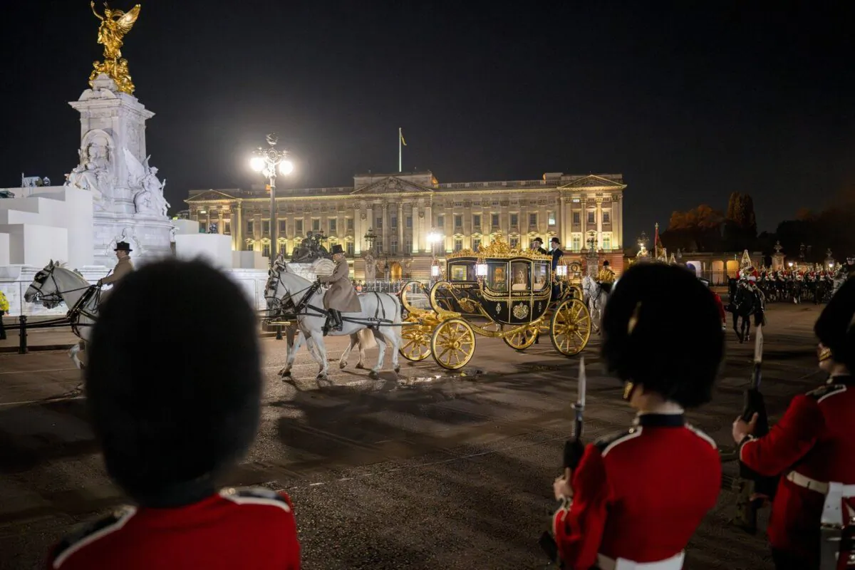 The Diamond Jubilee State Coach is led in a procession as it leaves Buckingham Palace, early May 3, 2023 during a rehearsal for the coronation of King Charles III which will take place at Westminster Abbey on May 6. (AP Photo/Vadim Ghirda)
