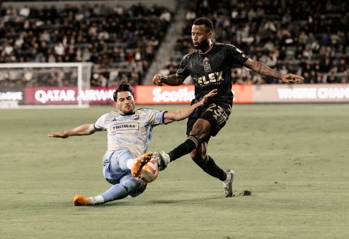 LAFC's Kellyn Acosta (23) attempts a cross that is blocked by Philadelphia Union's Julian Carranza (9) in a semi-final of the CONCACAF Champions League in Los Angeles on May 2, 2023. (Courtesy of LAFC)