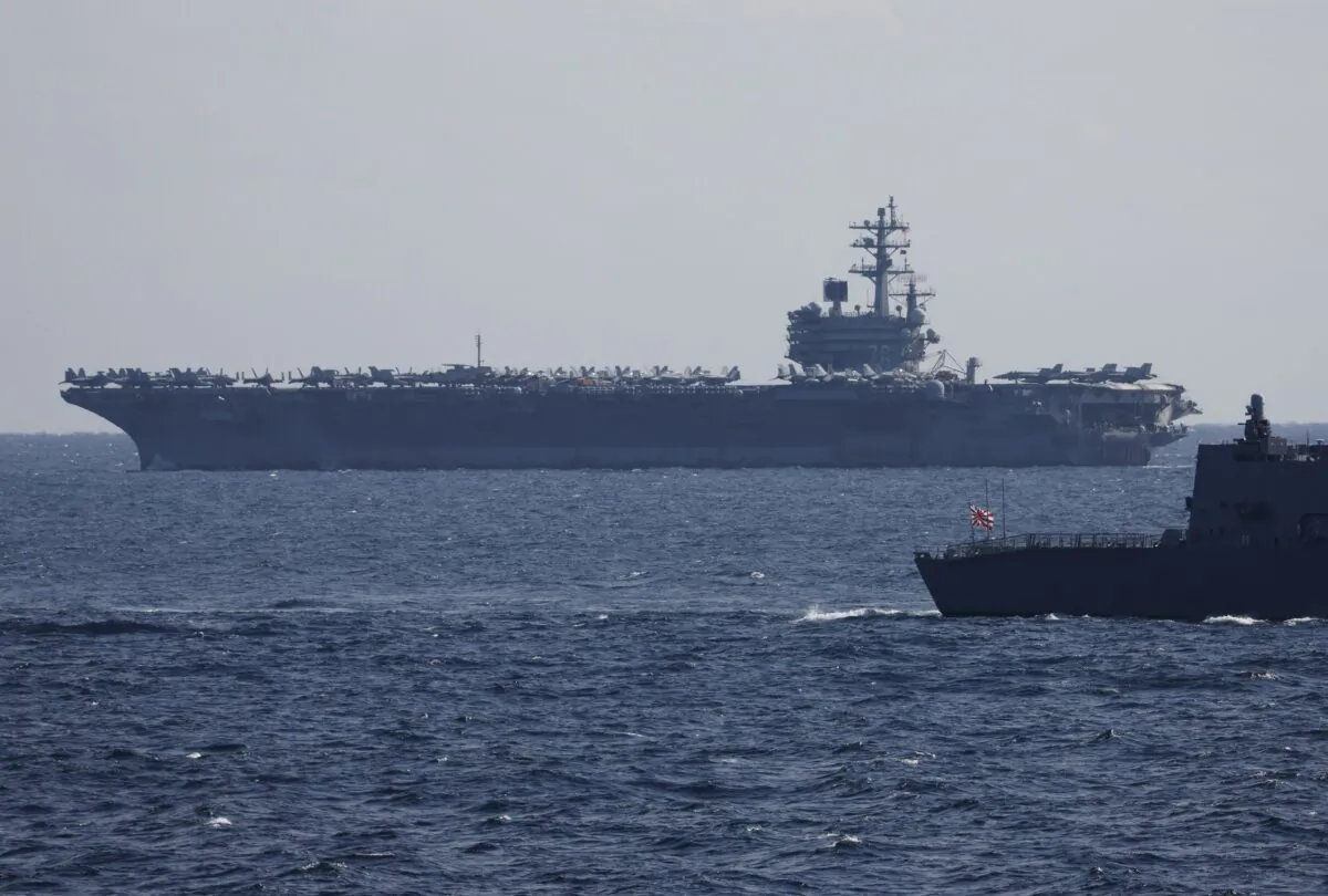 The USS Ronald Reagan, a Nimitz-class nuclear-powered super carrier, participates in an International Fleet Review commemorating the 70th anniversary of the founding of the Japan Maritime Self-Defense Force at Sagami Bay off Yokosuka, Japan, on Nov. 6, 2022. (Issei Kato-Pool/Getty Images)