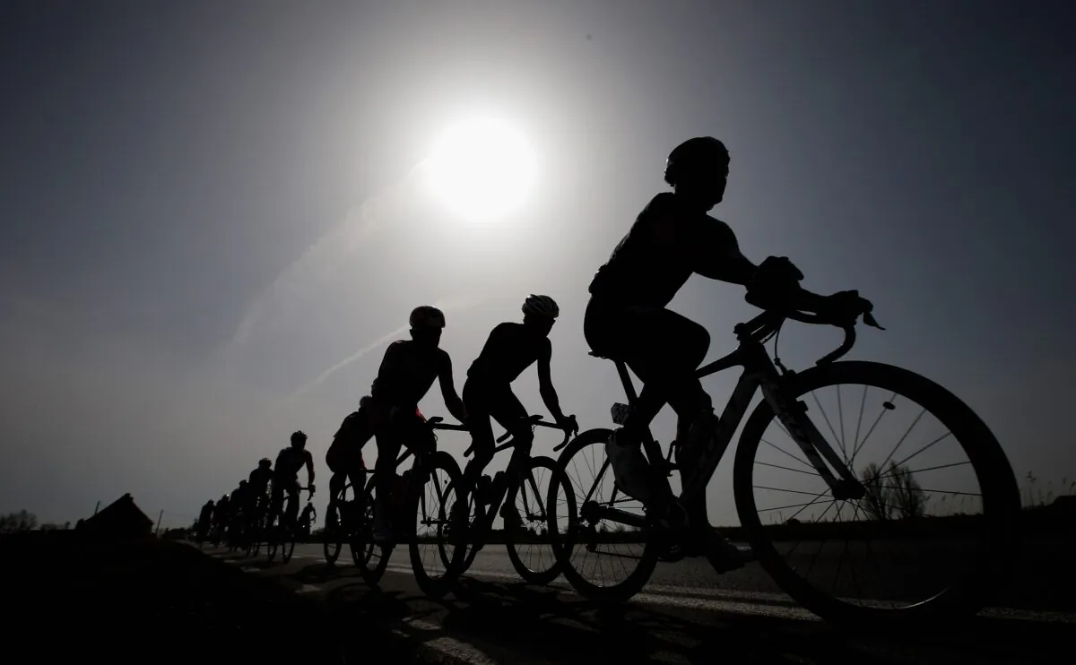 The peloton silhouetted by the sun during the Gent-Wevelgem Cycle Race in Gent, Belgium, on March 30, 2014. (Dean Mouhtaropoulos - Velo/Getty Images)
